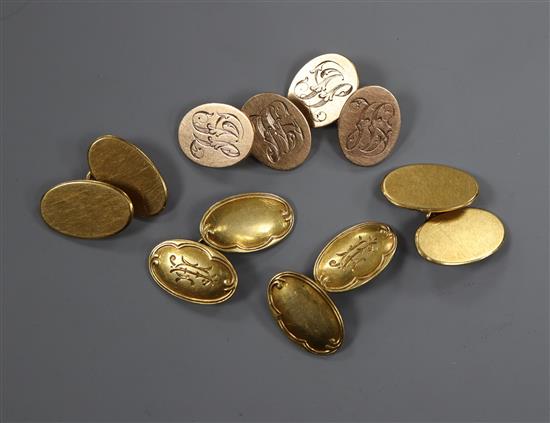 Two pairs of 18ct gold oval cufflinks and one pair of 9ct gold oval cufflinks.
